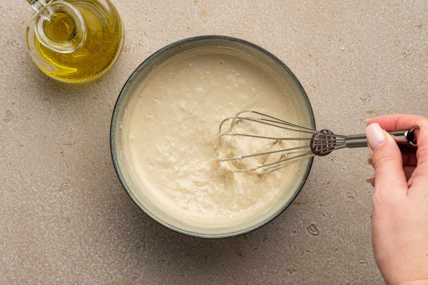 Caesar Dressing Mixed Together Using a Whisk
