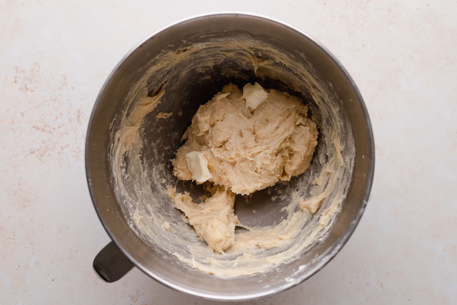 Kneaded dough in the bowl of a stand mixer to make braided chocolate babka