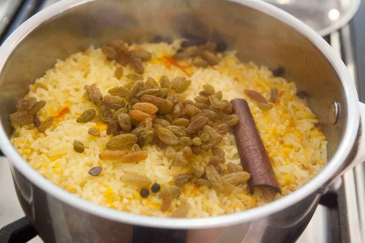 saffron rice topped with raisins and nuts 