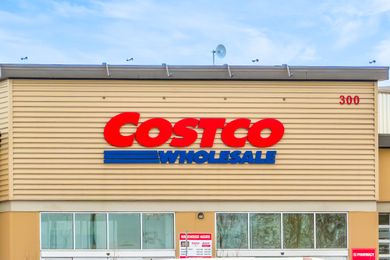 Exterior of a Costco Wholesale warehouse with the logo and signage visible