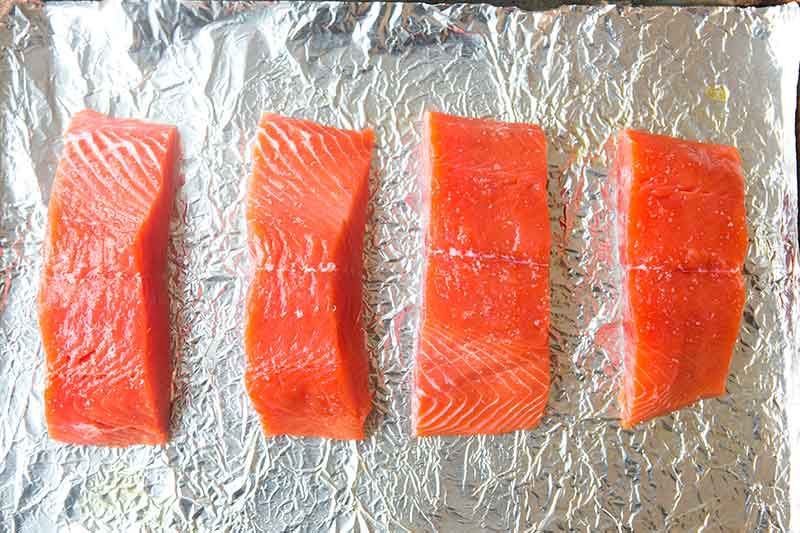raw salmon on the sheet pan