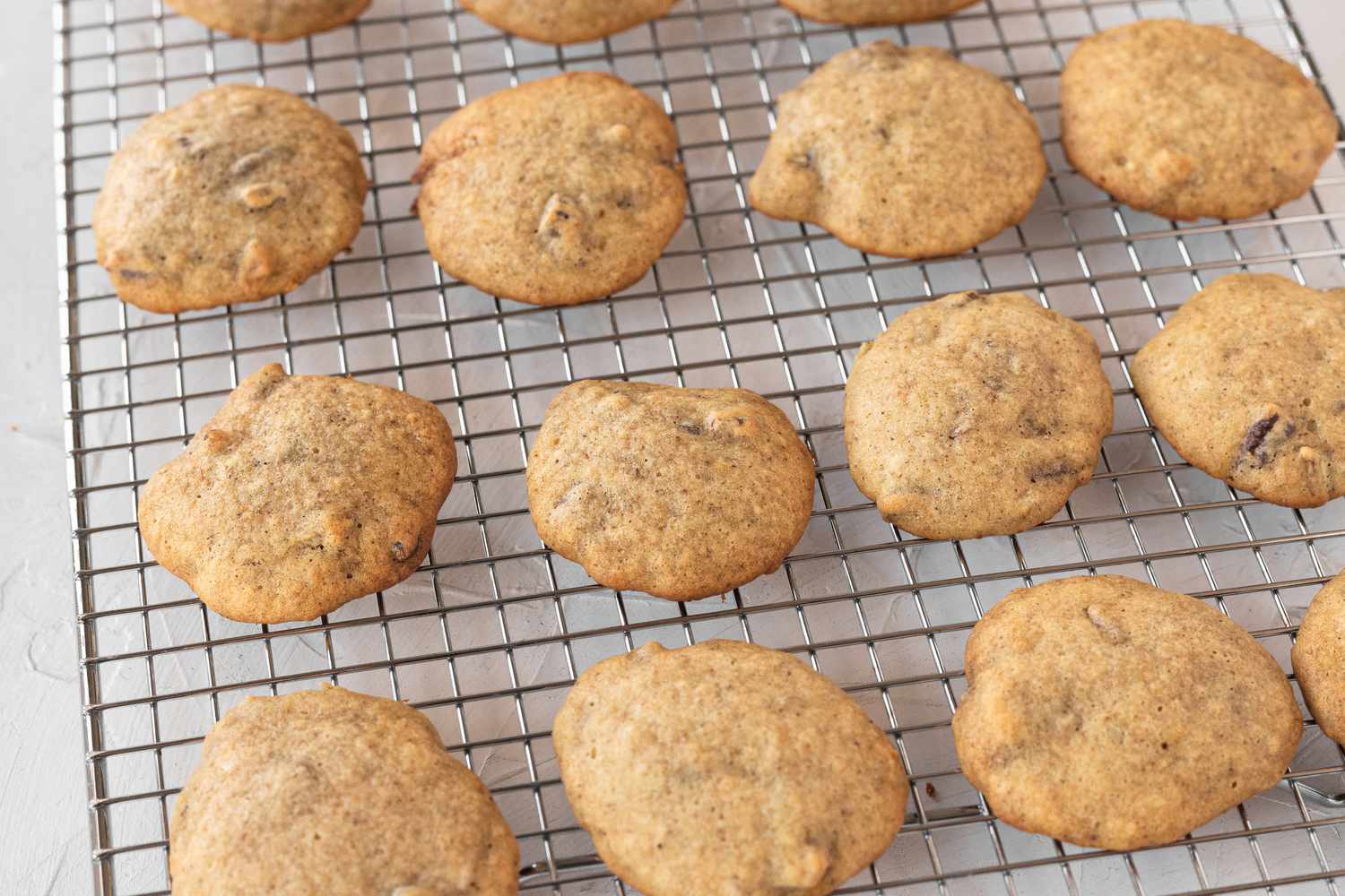 Banana cookies cooling on a rack.