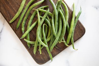 Green beans on a wood cutting board