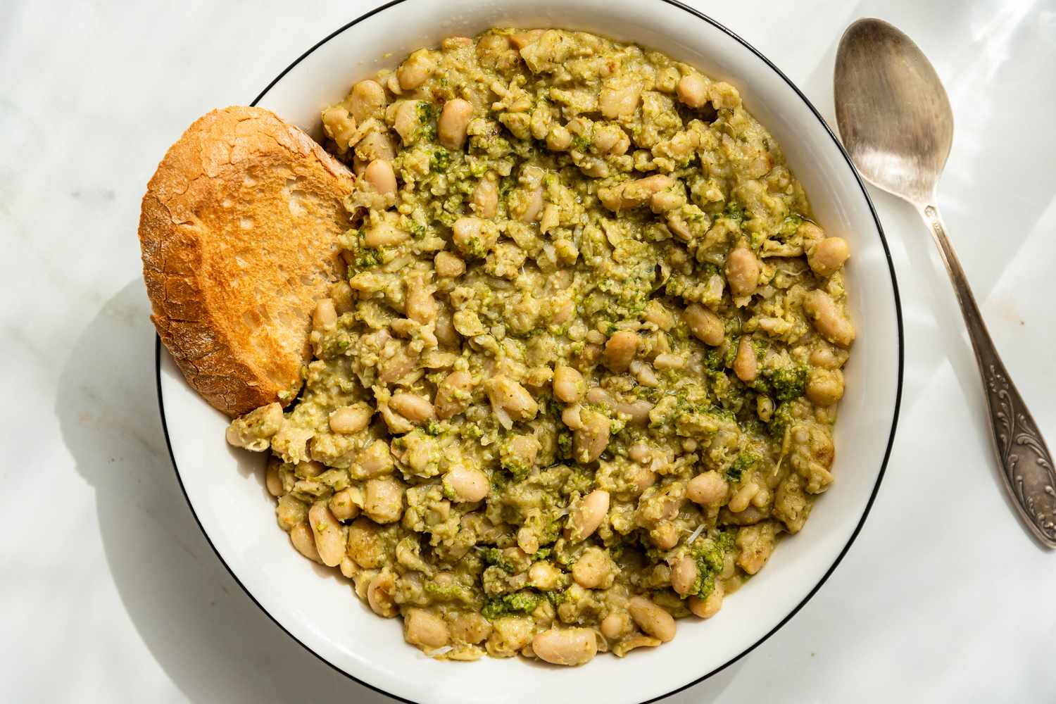 bowl of creamy pesto beans