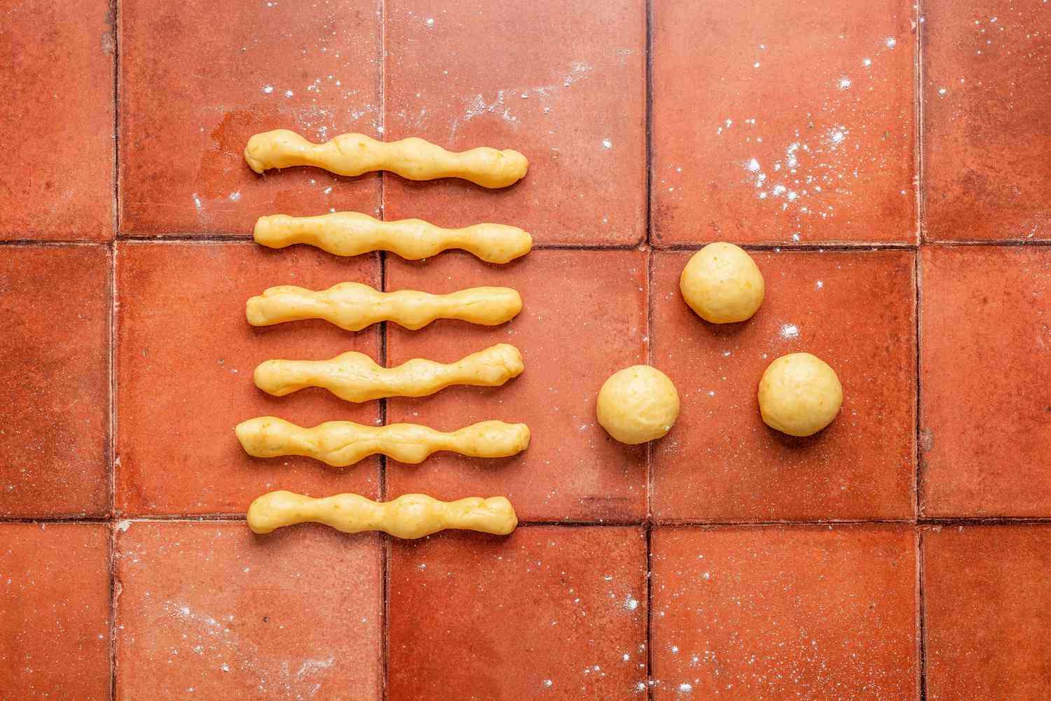 6 "bones" and 4 "skulls" on a lightly dusted surface 