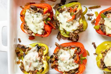 Cajun stuffed bell peppers in a baking dish