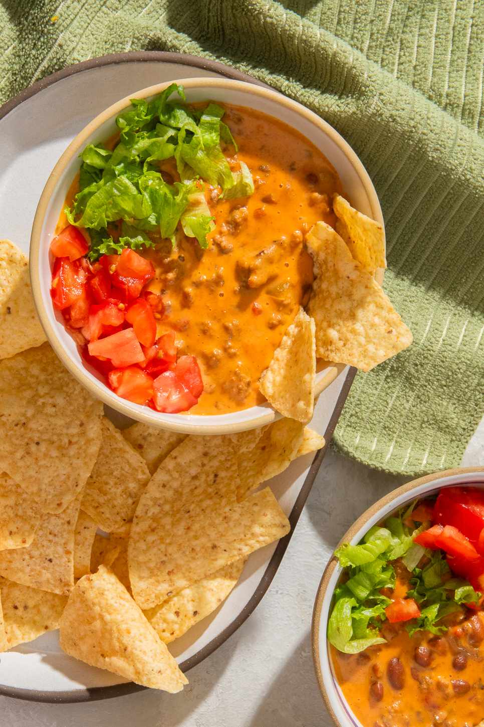 Creamed tacos in a bowl with lettuce and tomatoes