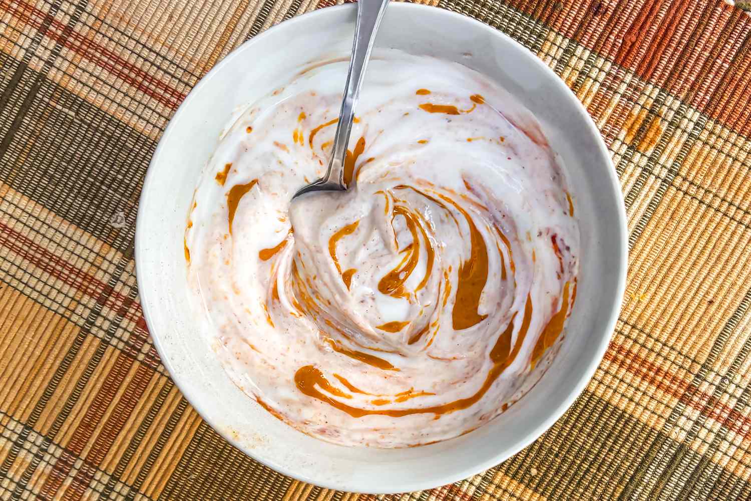 bowl of yogurt with peanut butter and cocoa mixed in