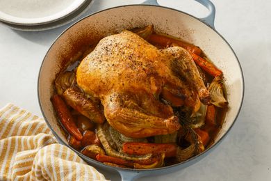 Roasted chicken over vegetable in a braiser