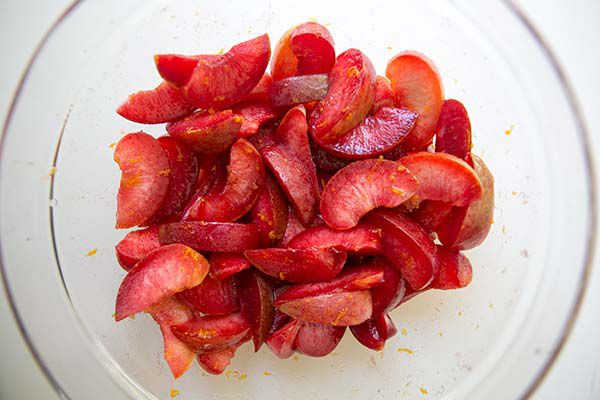 cut plums in a bowl
