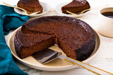 Jamaican Black Cake on a platter, slice cut
