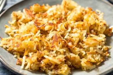 A plate of cooked hash browns