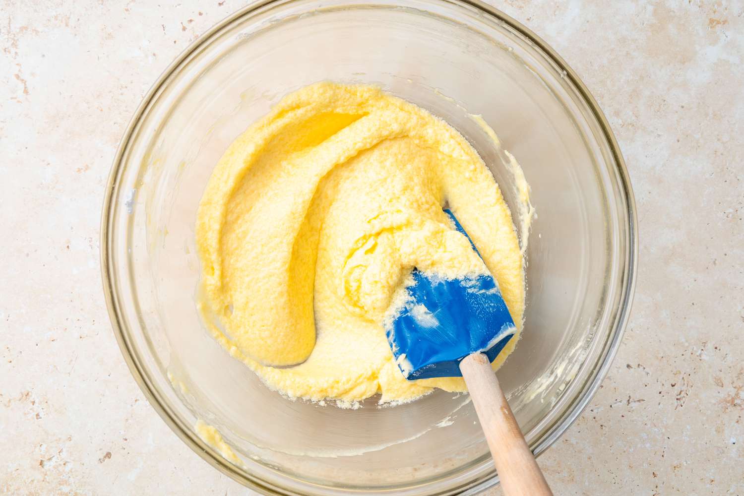 Desired Consistency of Egg and Butter Mixture in a Bowl With a Spatula 