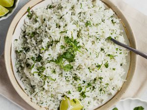 Bowl of Coconut Lime Rice with a Lime Wedge