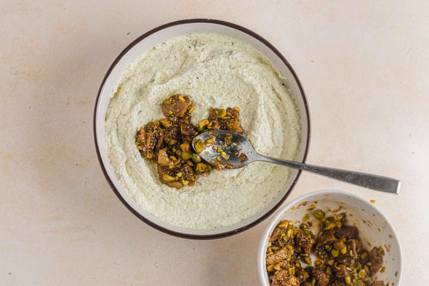 Spooning figs and dates over whipped feta.