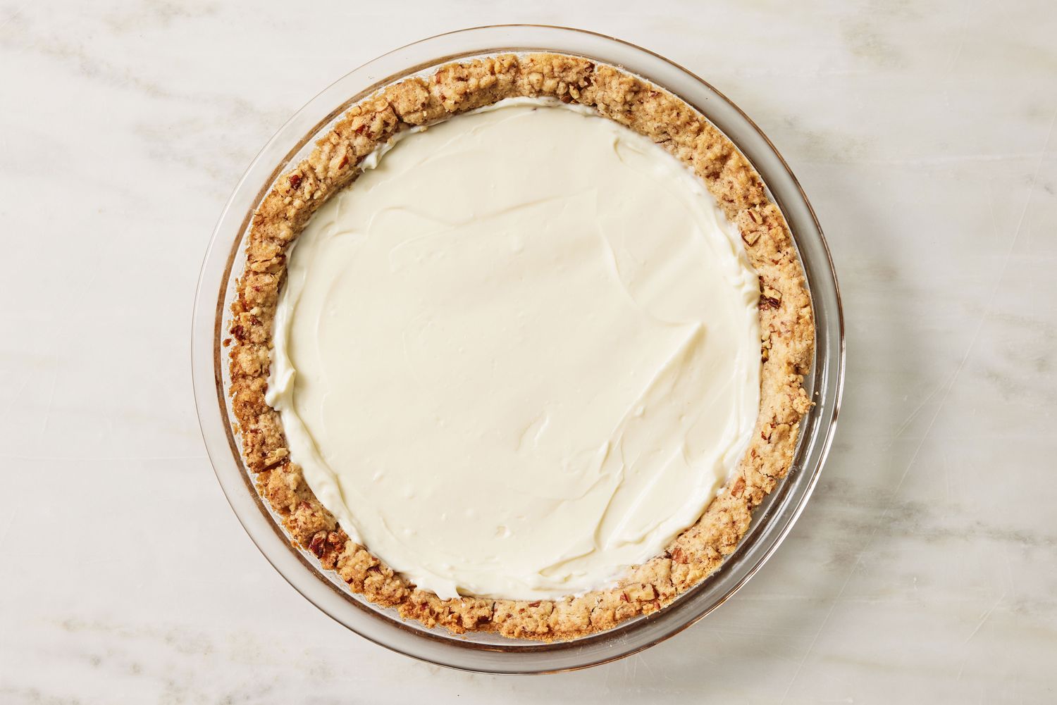 overhead view of cream cheese layer added to the Arkansas Possum Pie recipe