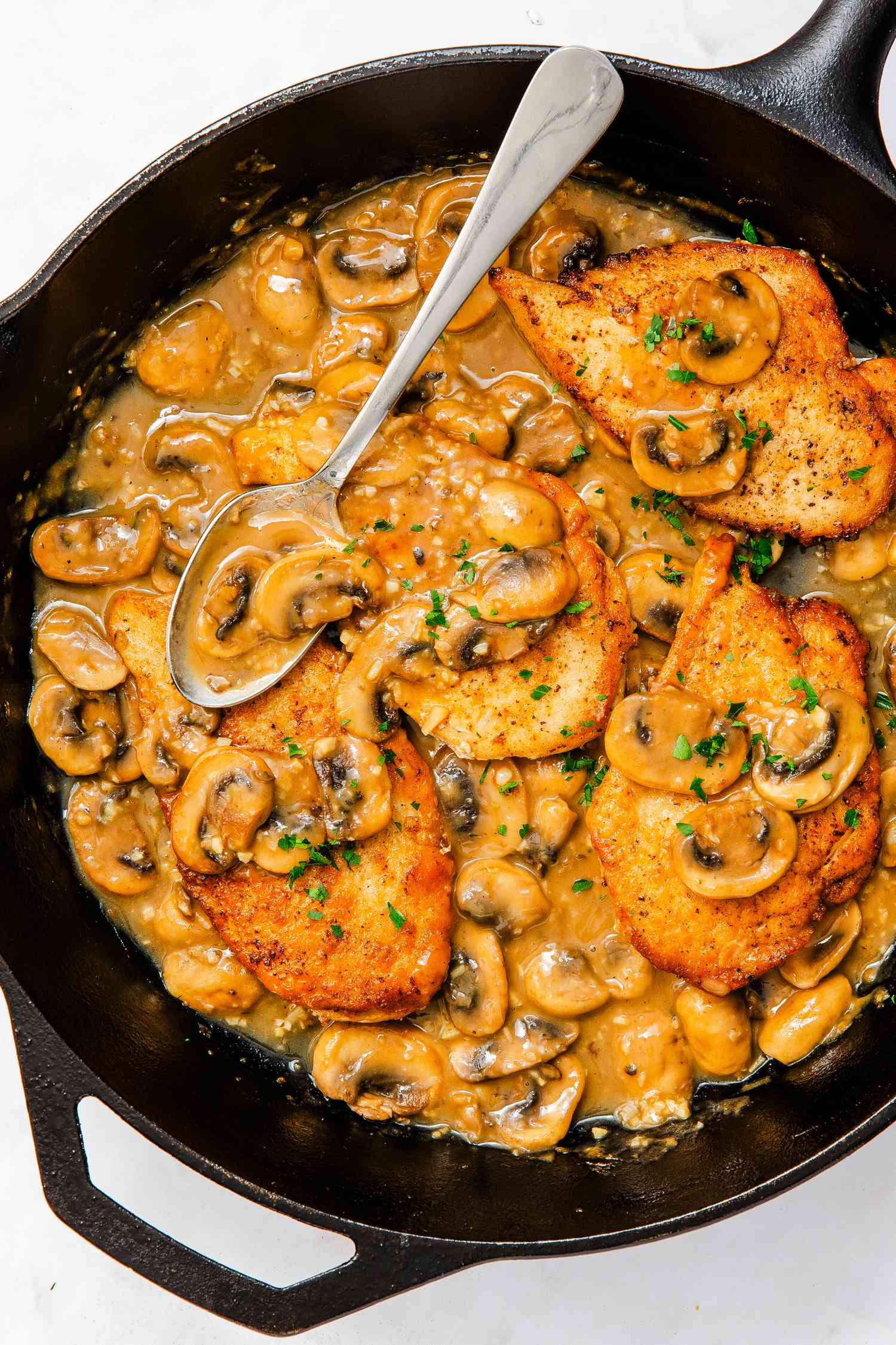 chicken marsala in a cast iron skillet