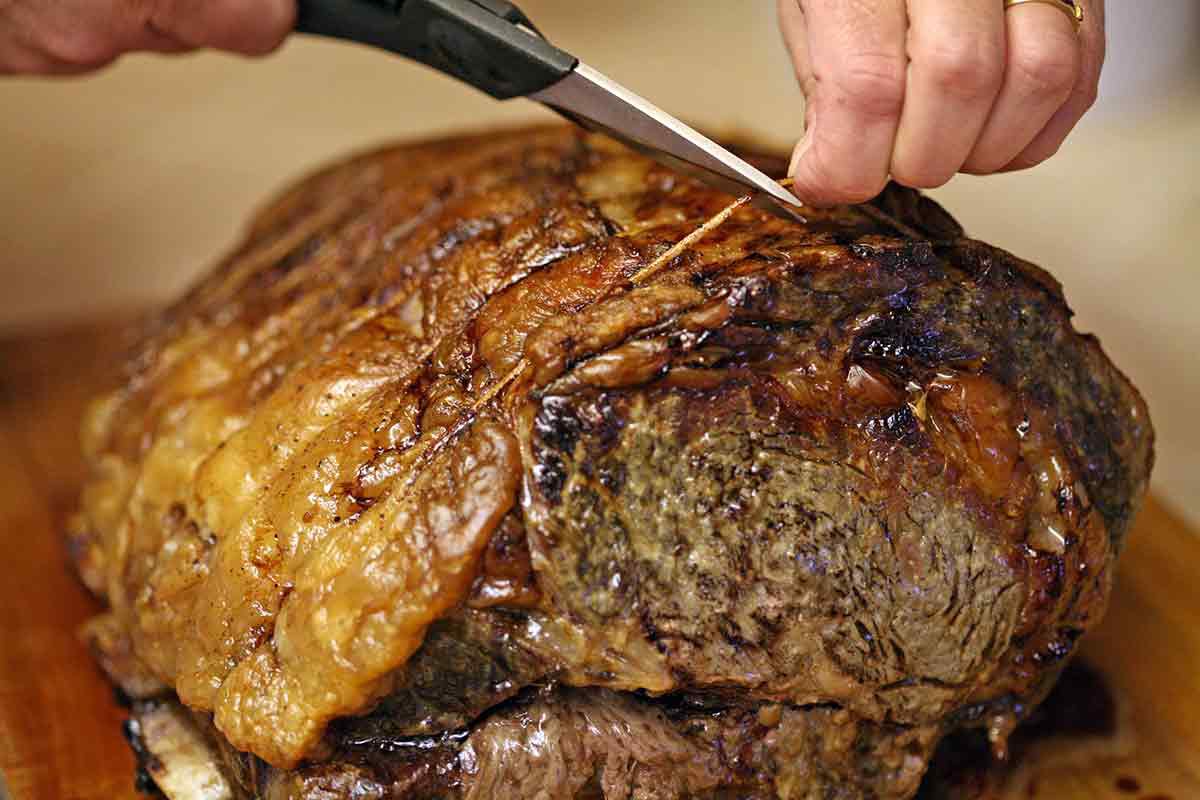 Snipping the twine off the finished prime rib