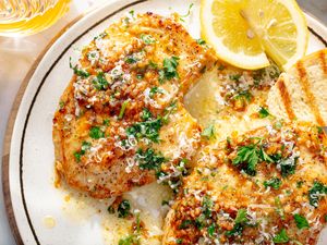 close up of Garlic Knot Chicken Breasts garnished with lemon wedges