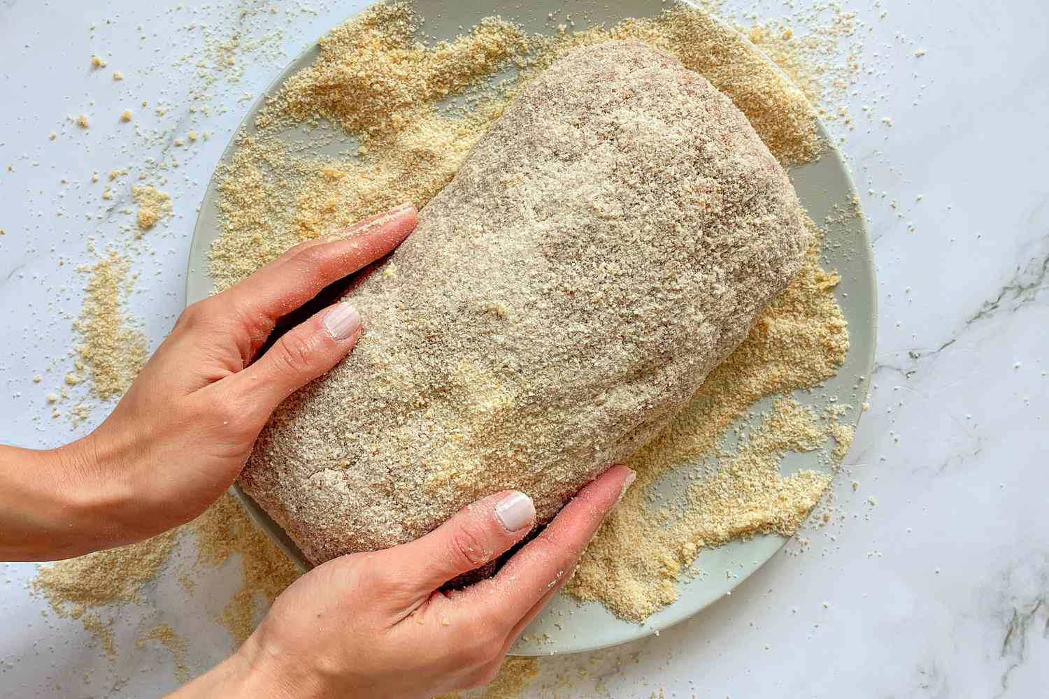 Pulpeta (Cuban Meatloaf) coated in breadcrumbs.