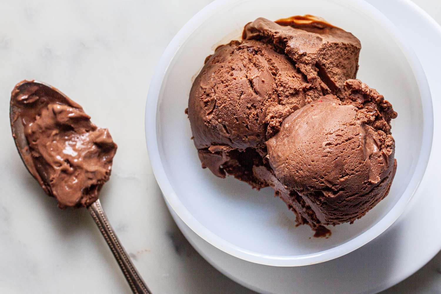 Overhead view of scoops mexican hot chocolate in a bowl.