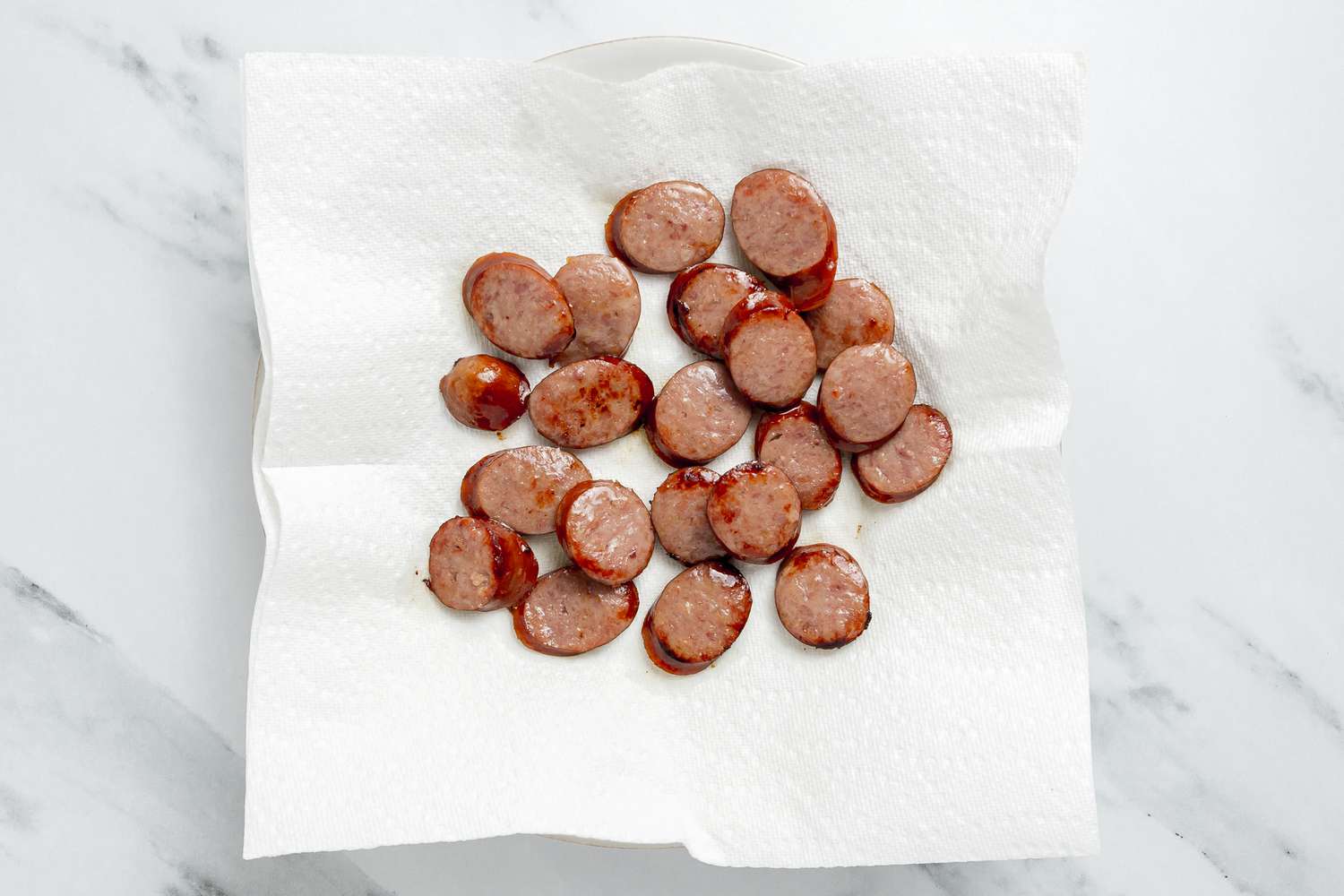 Andouille Sausage on a Paper Towel Lined Plate for Southern Dirty Rice With Shrimp Recipe