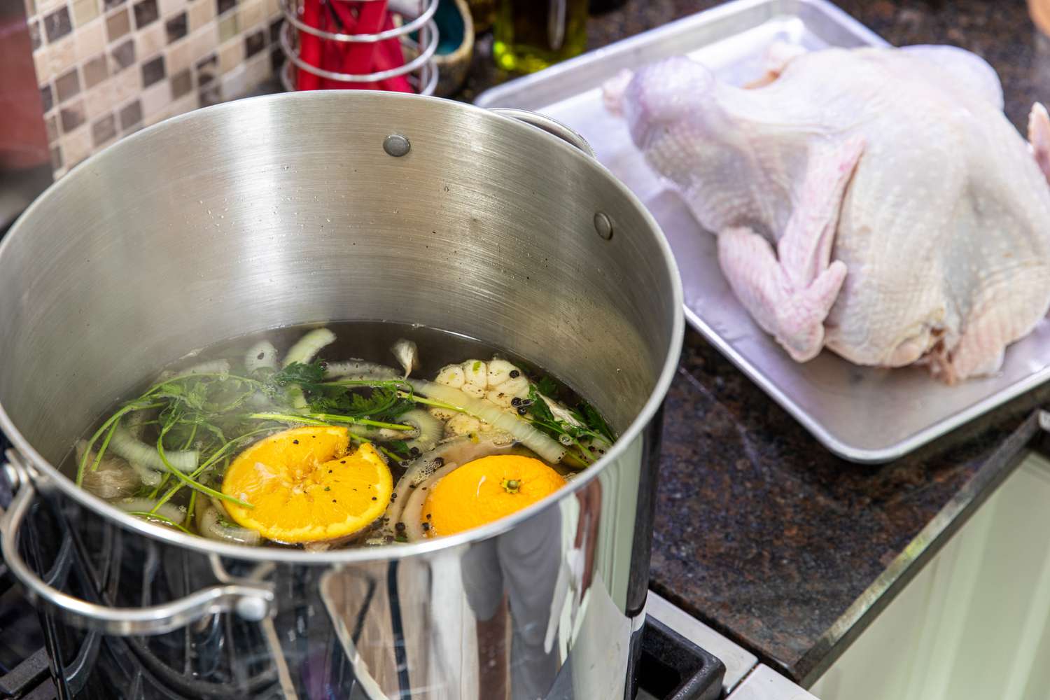 A large stockpot with brining liquid for whole turkey.