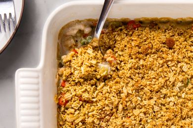 close-up view of Grandma's Creamy Vegetable Casserole with Crunchy Chex Topping in a baking dish