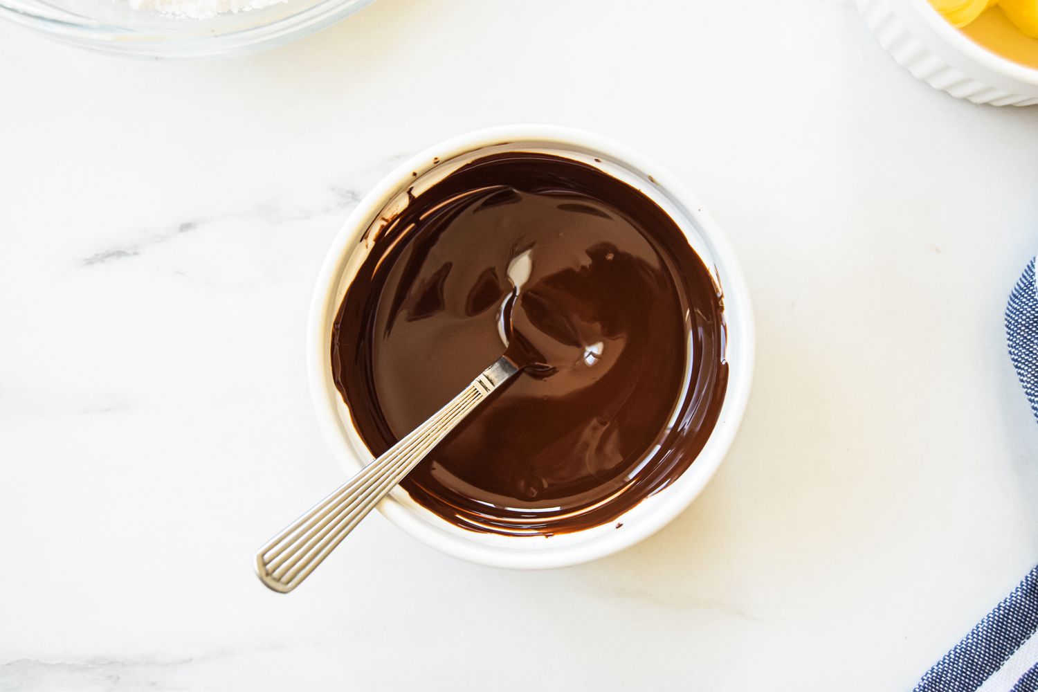 Bowl of Melted Chocolate for Chocolate Sheet Cake Recipe