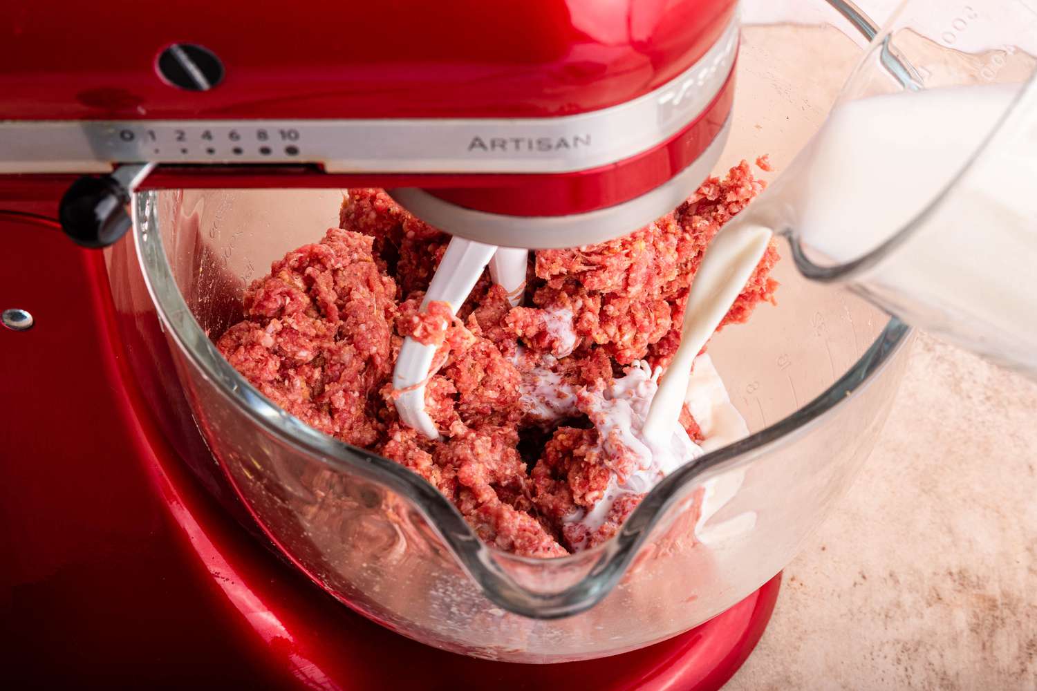 Milk Poured Into the Mixer Bowl With Easy Meatloaf Ingredients (Mixer Bowl Still on the Stand Mixer)