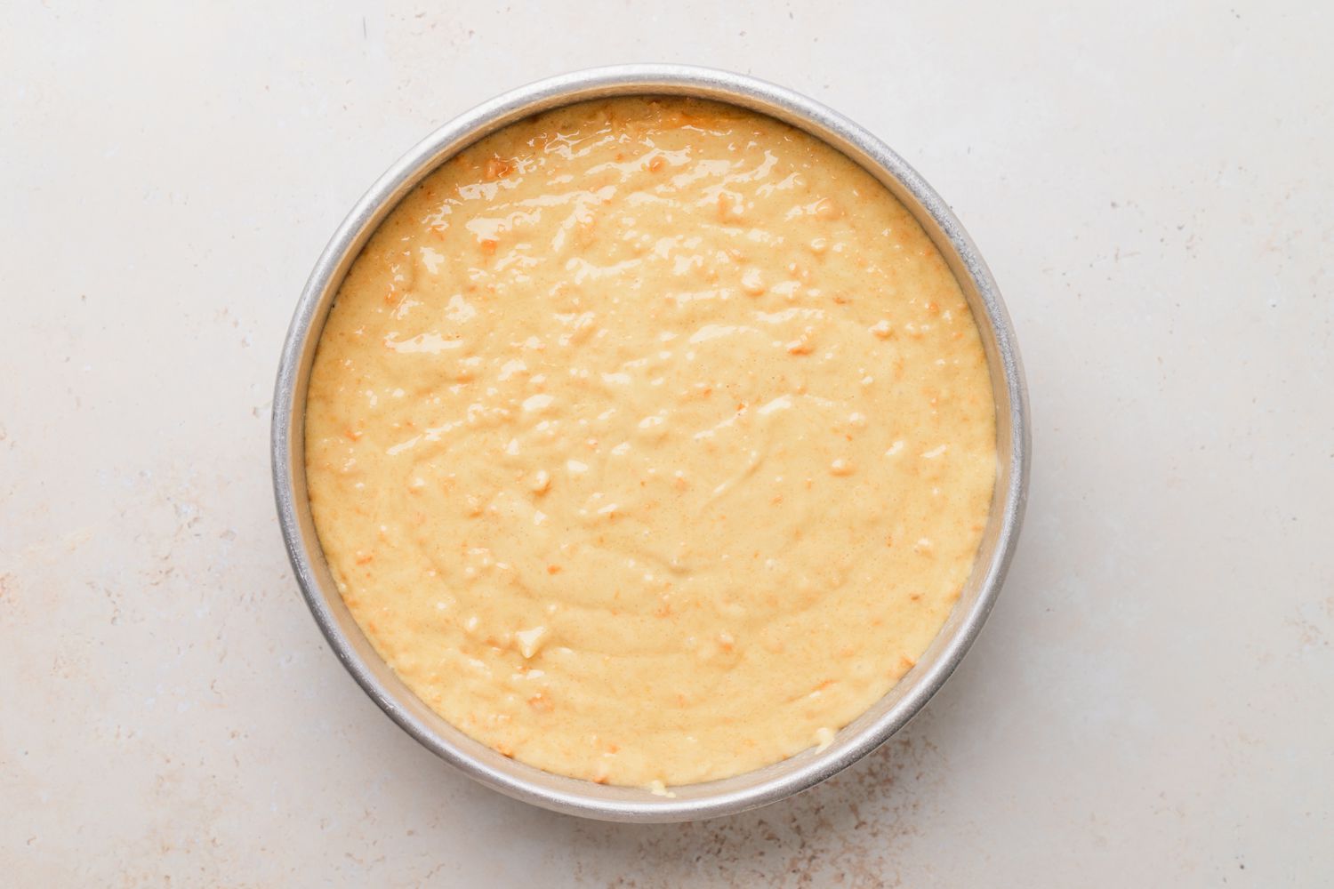 Scrape batter into prepared cake pan.
