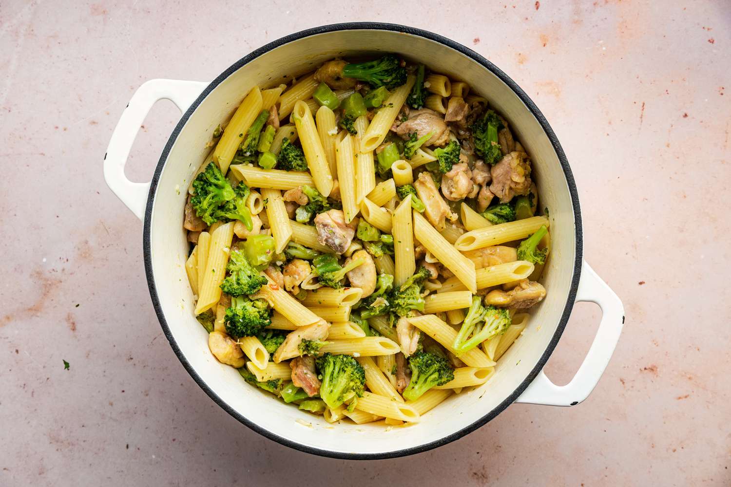 Broccoli and Chicken Added to Dutch Oven with Pasta 