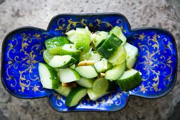 cucumber salad with grapes and almonds in a bowl