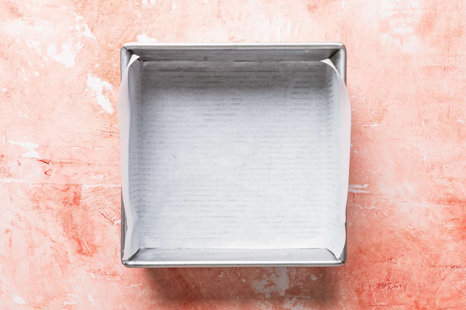 parchment paper-lined square baking pan