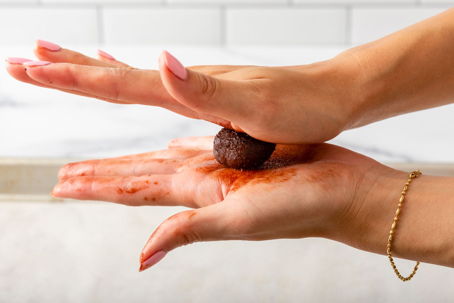 Hand rolling ganache for a chocolate truffle recipe.