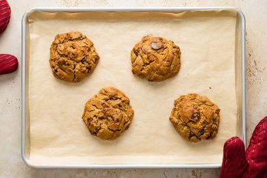 Four big chocolate chip cookies baked on Nordic Ware sheet pan
