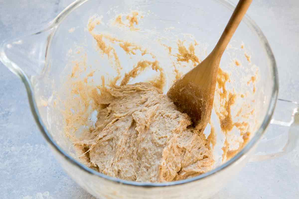 Use a spoon to mix a the hot cross buns ingredients into a shaggy dough