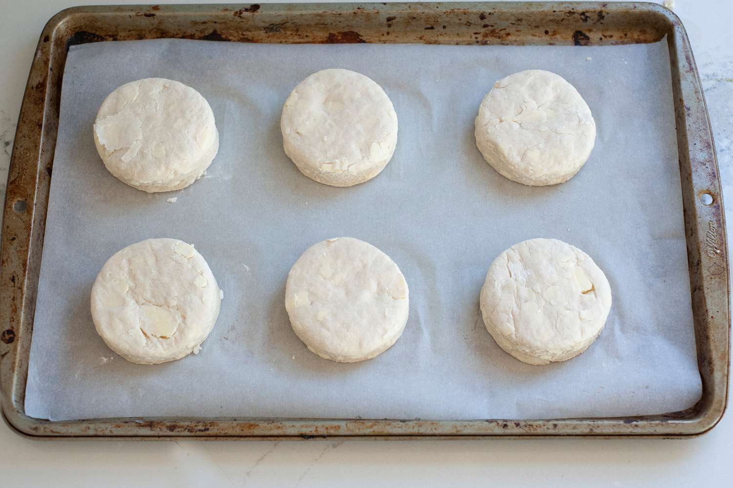 Biscuits on a sheet pan before baking