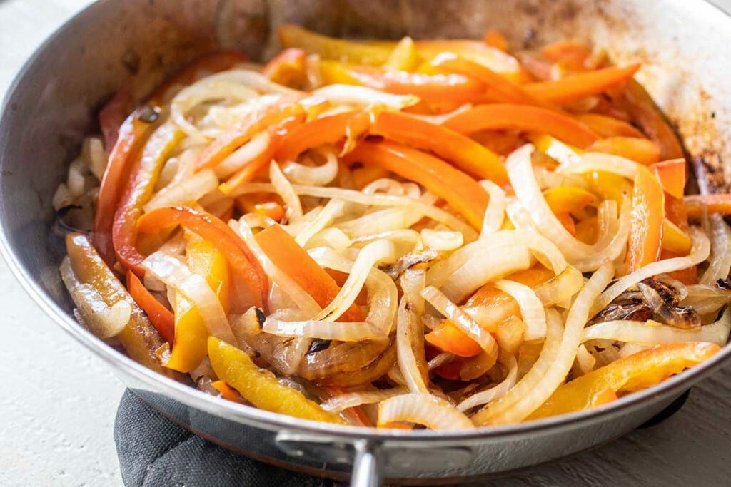 Cook the onions and peppers for chicken freezer burritos