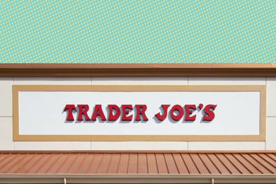 The sign of a Trader Joe's store featuring bold, red lettering on a white background