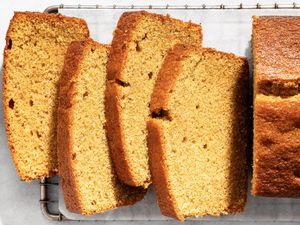 Sliced brown sugar pound cake on a cooling rack displaying its texture and layers