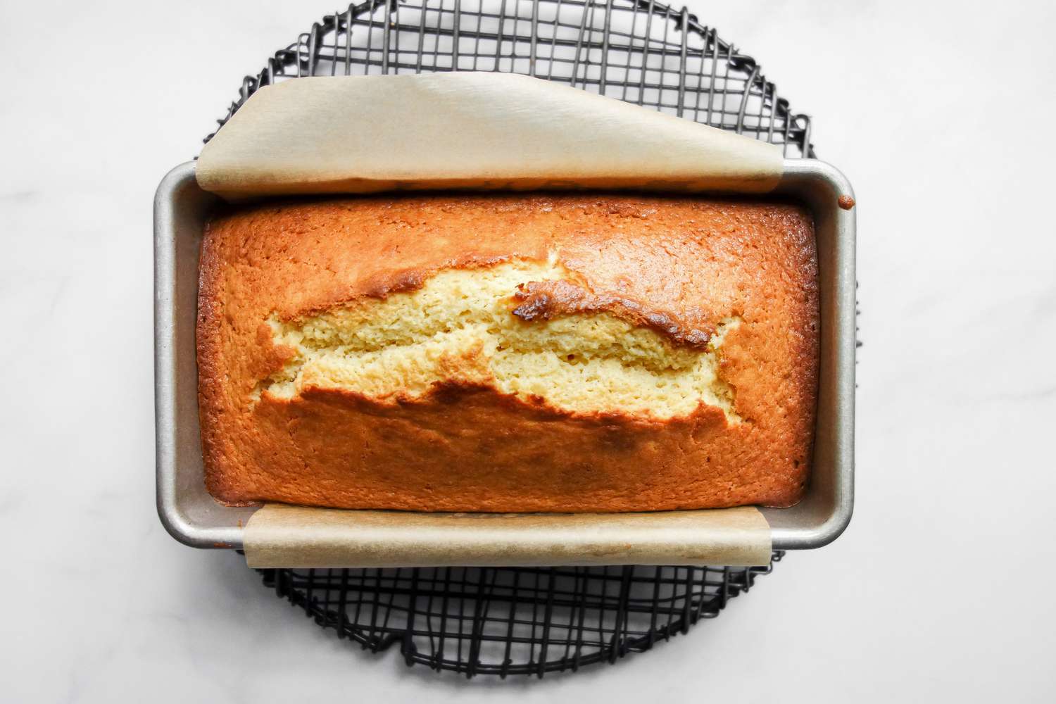 baked coconut pound cake in loaf pan.