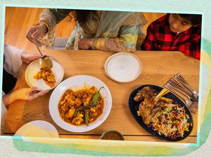 People sitting around a table for Eid