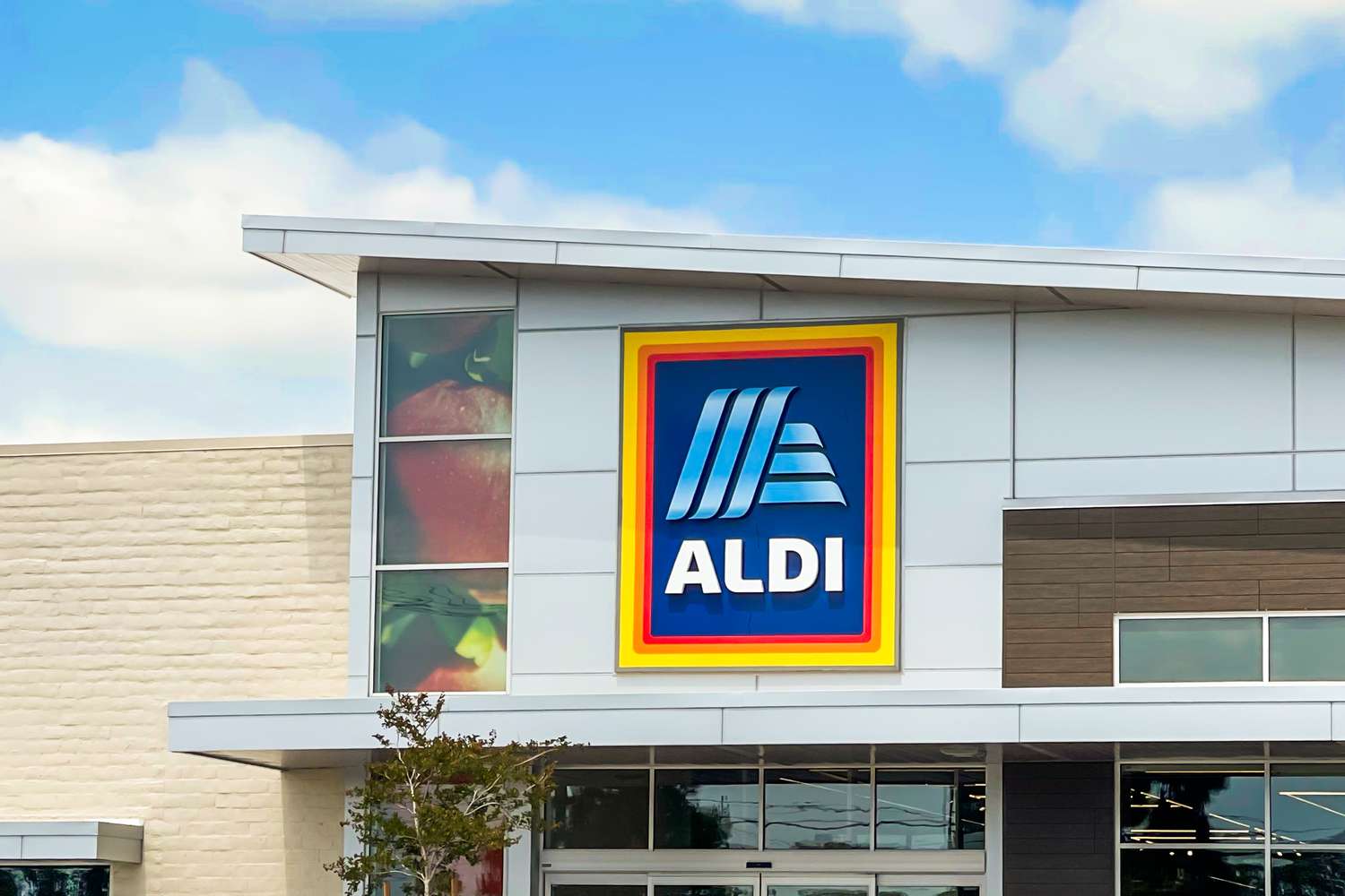 Exterior view of an Aldi store with its logo prominently displayed on the building