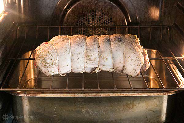 Leg of lamb roasting in oven
