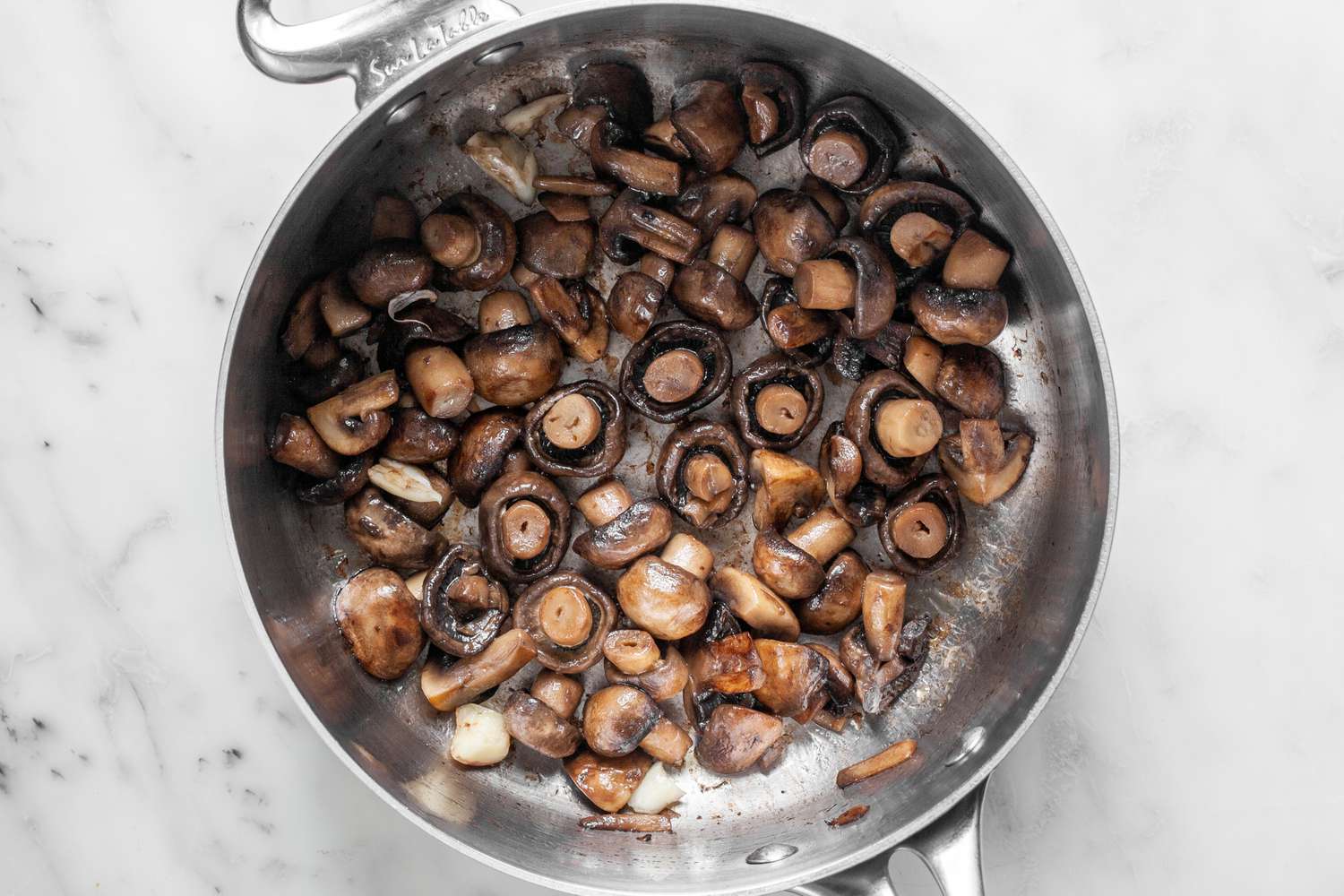 Cooked Mushrooms in a Wide Sauce Pan