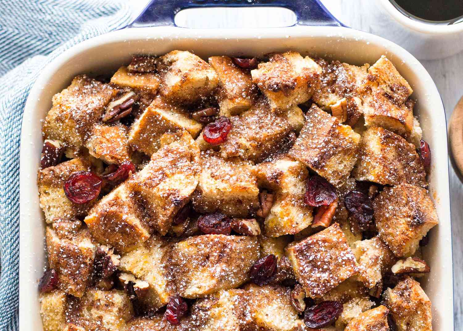 A French toast casserole in a white baking pan