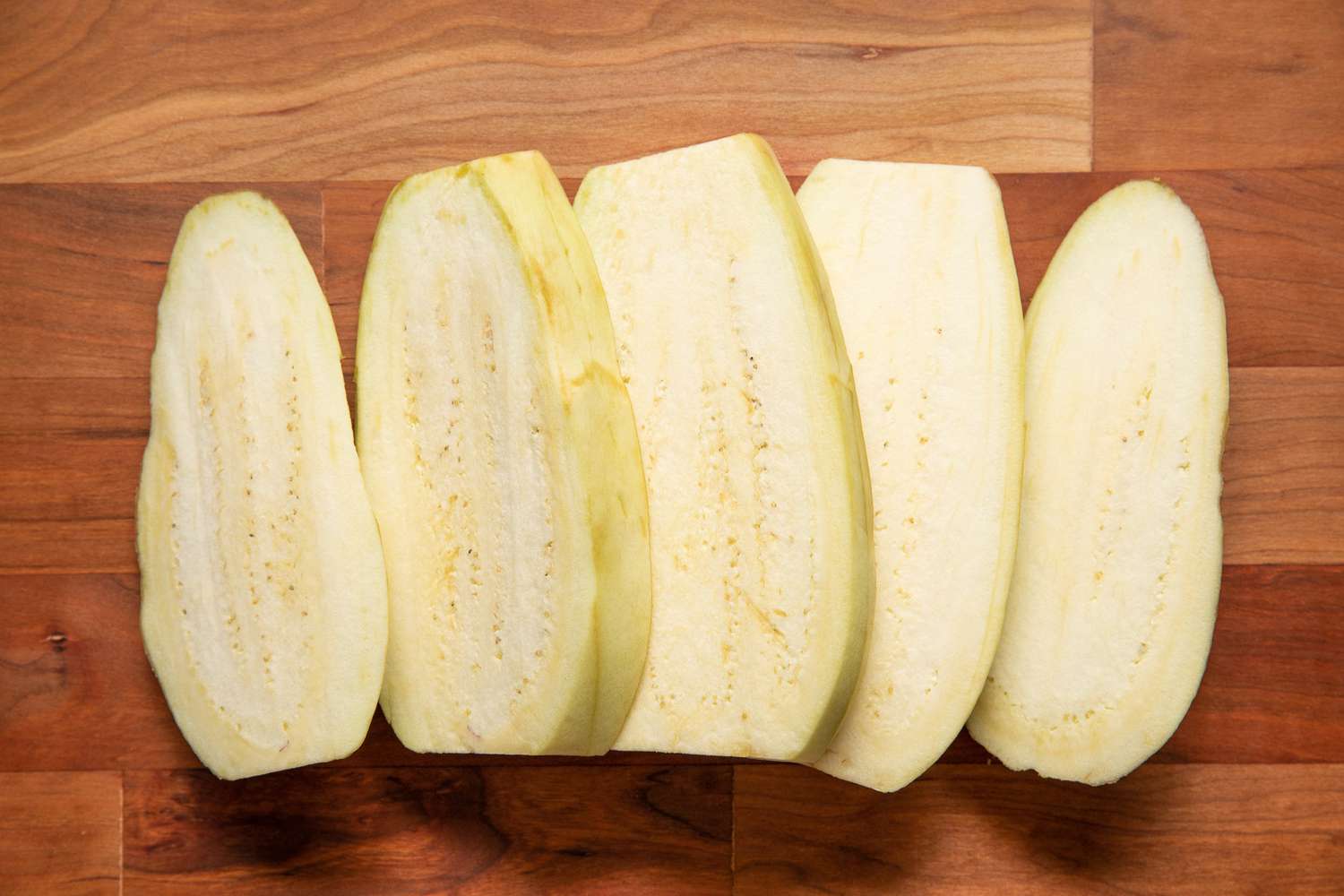 Peeled Eggplant Cut Into Slices for Oven-Baked Eggplant Recipe