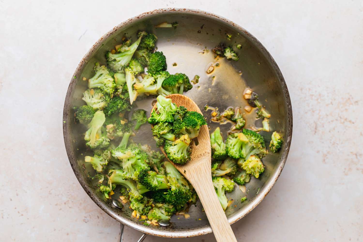 Making broccoli stir fry in a wok.
