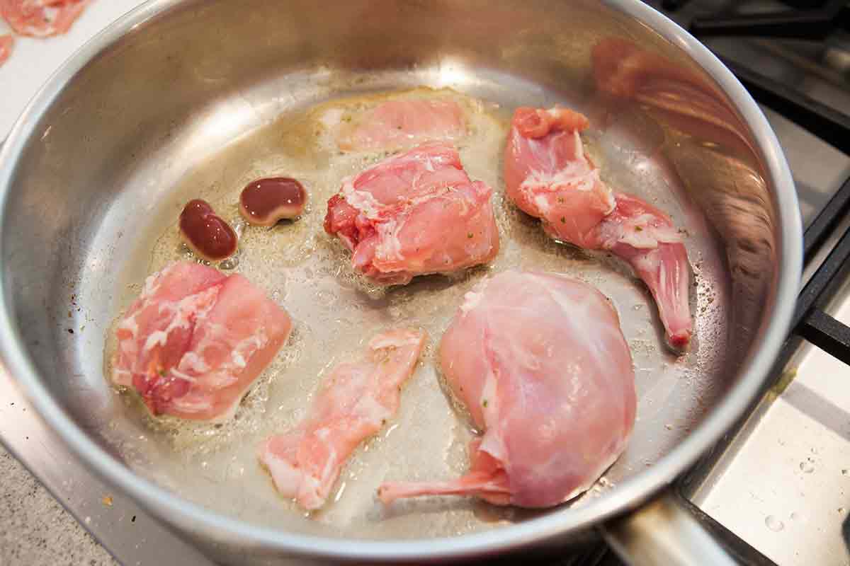 brown rabbit pieces in butter for rabbit recipe